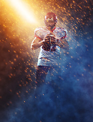 Image showing portrait of confident American football player standing on the f