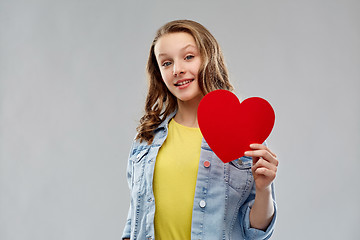 Image showing smiling teenage girl with red heart