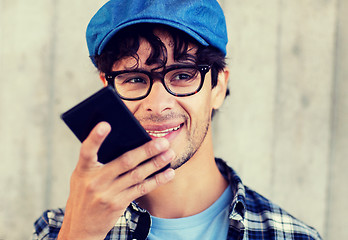 Image showing man using voice command or calling on smartphone