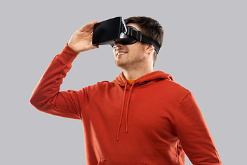 Image showing happy man in virtual reality headset or vr glasses