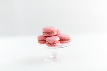 Image showing pink macarons on glass confectionery stand