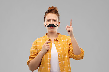 Image showing teenage girl with moustaches pointing finger up