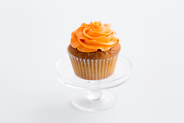 Image showing cupcake with frosting on confectionery stand