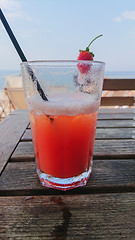 Image showing Orange cocktail on the wooden table