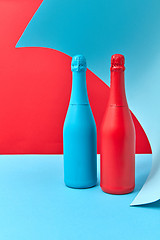 Image showing Decorative composition of two painted wine mock up bottles.