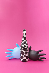 Image showing Two balloon latex gloves with spotted wine bottle painted.