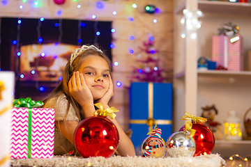 Image showing Ten-year-old girl dreams of a New Year gift