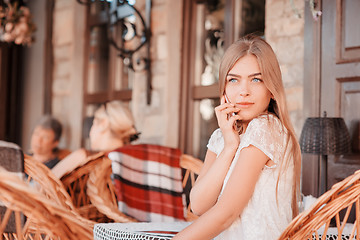 Image showing Young beautiful smiling woman talking on cell phone