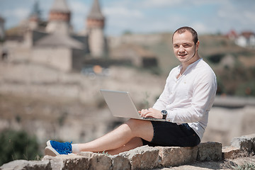 Image showing Man using a modern portable computer on the park