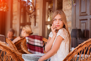 Image showing Young beautiful smiling woman talking on cell phone