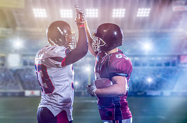 Image showing american football players celebrating after scoring a touchdown