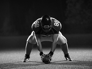 Image showing American football player starting football game