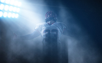 Image showing american football player celebrating after scoring a touchdown