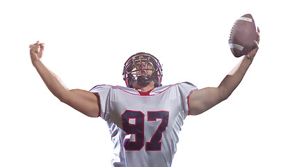 Image showing american football player celebrating after scoring a touchdown