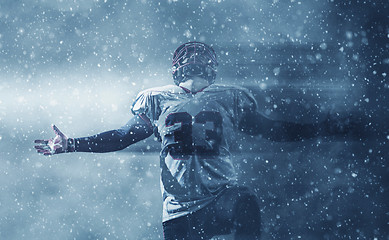 Image showing american football player celebrating after scoring a touchdown