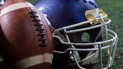 Image showing closeup of american football,helmets and trophy