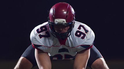 Image showing American football player starting football game