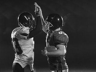 Image showing american football players celebrating after scoring a touchdown