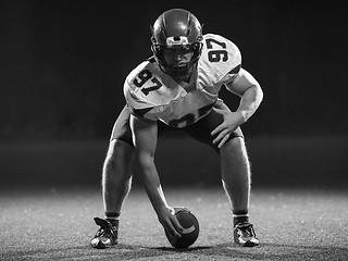 Image showing American football player starting football game