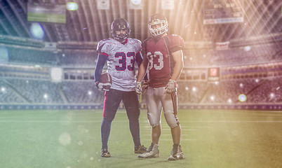 Image showing Two American football players standing  on the field