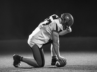 Image showing American football player starting football game