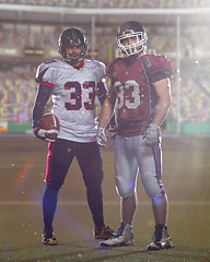 Image showing Two American football players standing  on the field