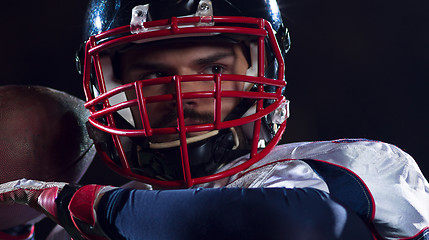 Image showing american football player throwing rugby ball