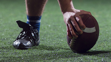 Image showing American football player starting football game