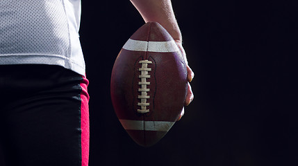 Image showing rear view of young confident American football player