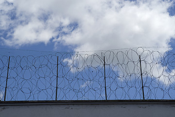 Image showing Prison wall and fence, barbed wire