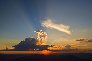 Image showing Orange sunset, sun after clouds from the top