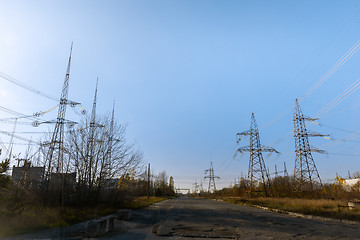 Image showing Large pylons at power distributing station