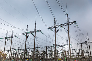 Image showing Large pylons at power distributing station