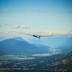 Image showing Duodiscus Glider Flying around Mountains