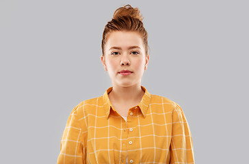 Image showing red haired teenage girl in checkered shirt