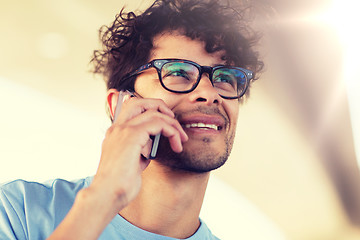 Image showing man with smartphone calling on city street