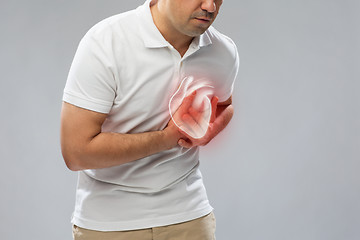 Image showing close up of man having heart attack or heartache