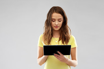 Image showing young woman or teenage girl using tablet computer