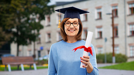 Image showing happy senior graduate student woman with diploma