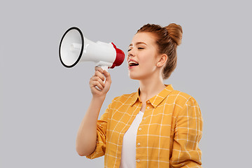 Image showing red haired teenage girl speaking to megaphone