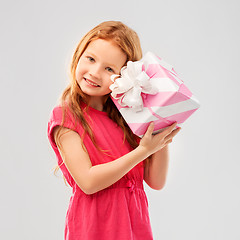 Image showing lovely red haired girl with birthday gift