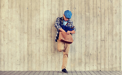 Image showing hipster man looking for something in his bag