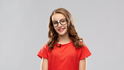 Image showing smiling student girl in glasses and red t-shirt