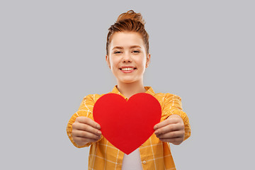 Image showing smiling red haired teenage girl with heart