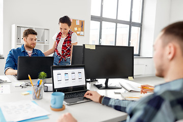 Image showing creative team working on user interface at office