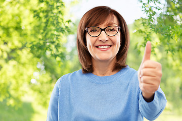 Image showing portrait of senior woman showing thumbs up