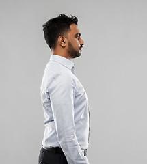 Image showing indian businessman side view over grey background