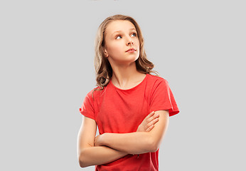 Image showing teenage girl in red t-shirt with crossed arms