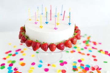 Image showing close up of birthday cake with candles on stand