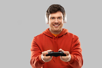 Image showing man with gamepad playing video game